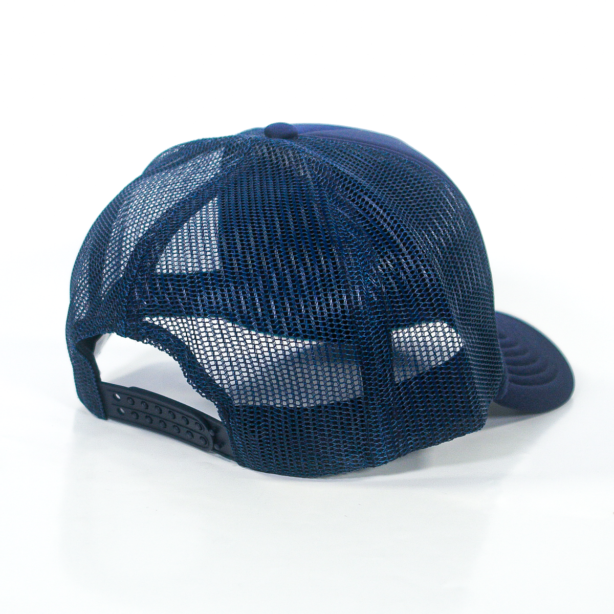 Dark blue Valucap trucker hat with a polyester mesh back and an adjustable snapback closure.