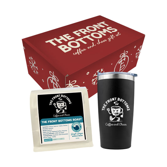 A red gift box labeled The Front Bottoms coffee and chaos sits behind a black tumbler and a bag of The Front Bottoms Roast Coffee by Movement Roasters, both with The Front Bottoms’ logo.