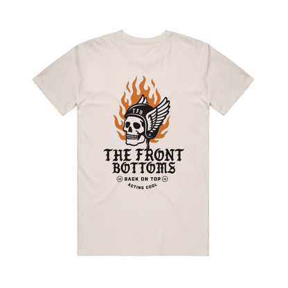 A beige Gildan Heavy Cotton T-shirt with a helmeted skull, “TFB,” flames, and wings. Below: bold "The Front Bottoms" and small text “Back on Top” & “Acting Cool.” Brand: The Front Bottoms.